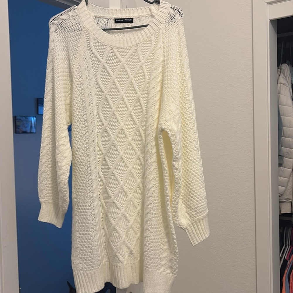 Really warm white sweater dress. Never worn not see through.